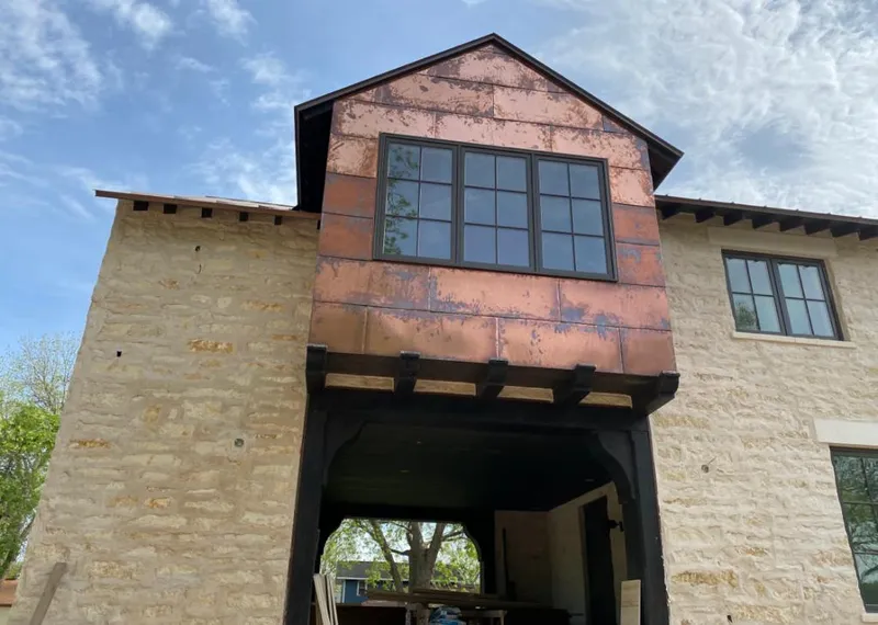 Copper metal panel facade on a stone building for Metal Roof Coating in Fort Wright