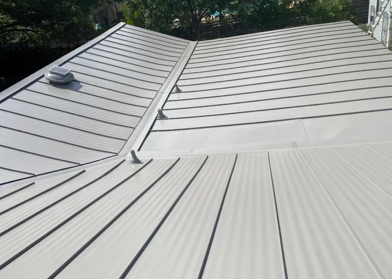 Solar attic fan installed on a metal roof for Roof Ventilation in Fort Wright
